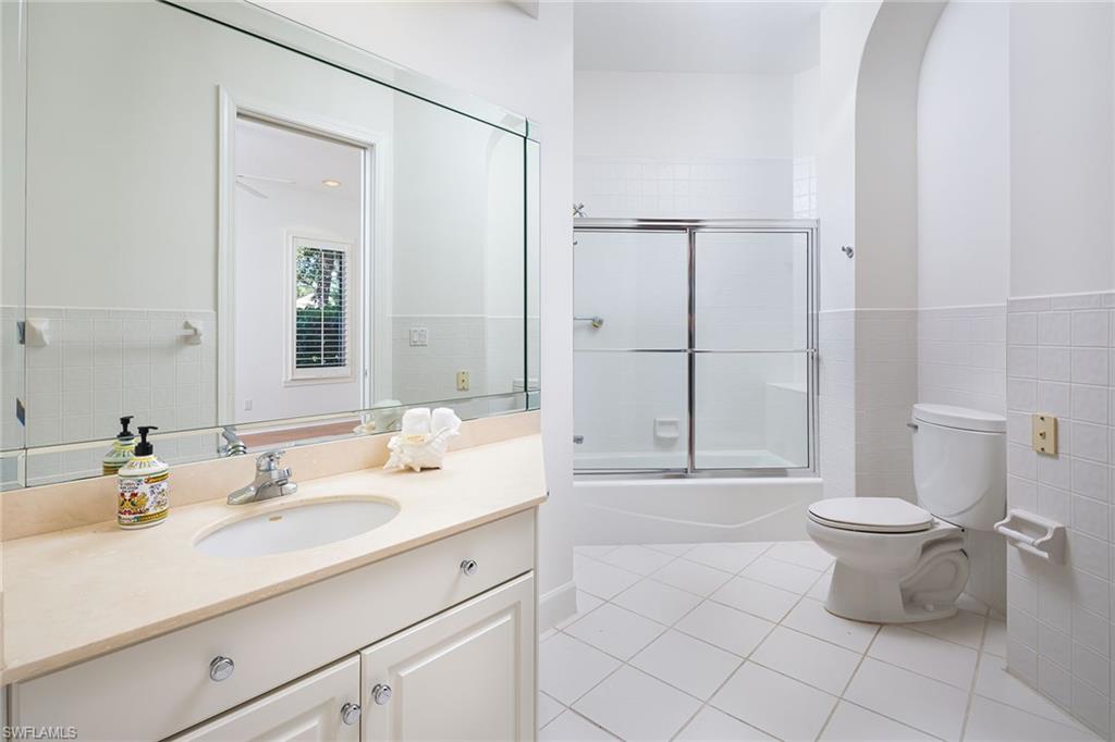 896 Barcarmil Way Naples, FL 34110 - Photo 24 of 45 a bathroom with a sink toilet and shower