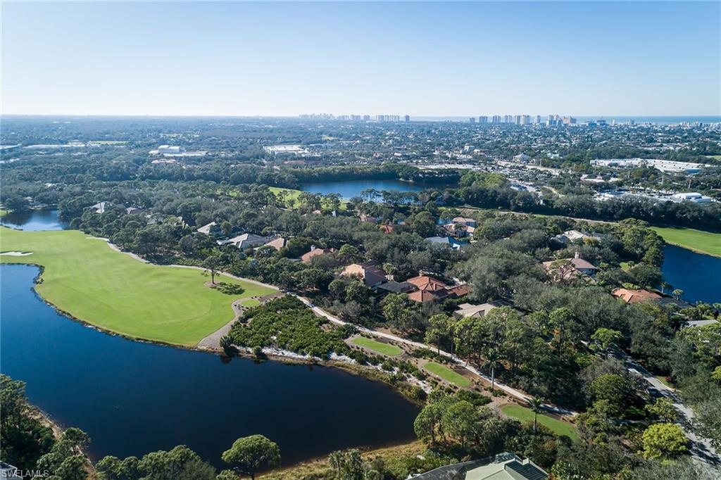 896 Barcarmil Way Naples, FL 34110 - Photo 32 of 45 an aerial view of a residential houses with outdoor space and swimming pool