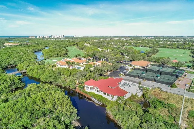 an aerial view of residential houses with outdoor space and street view