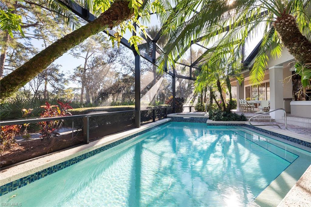 896 Barcarmil Way Naples, FL 34110 - Photo 4 of 45 a view of swimming pool with chairs