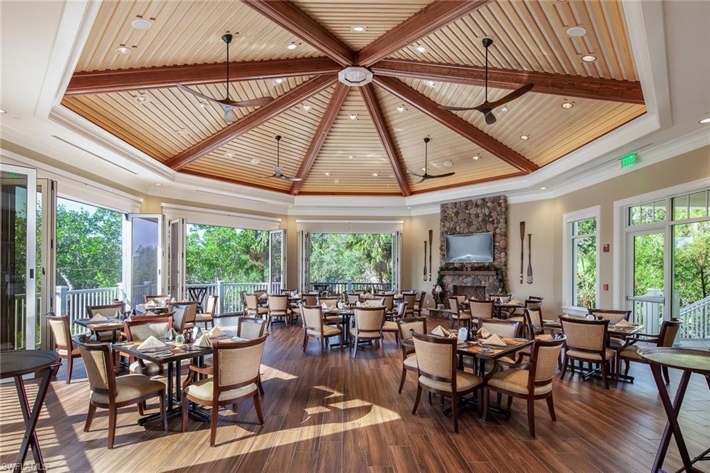 896 Barcarmil Way Naples, FL 34110 - Photo 43 of 45 a view of a dining room with furniture window and outside view