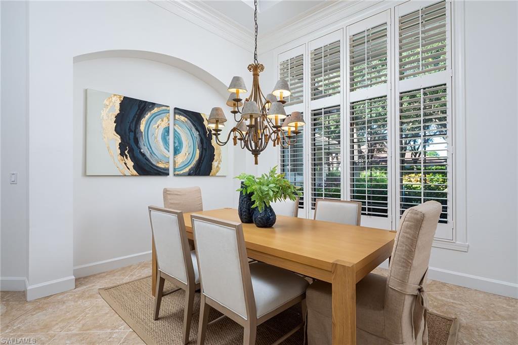 896 Barcarmil Way Naples, FL 34110 - Photo 10 of 45 a view of a dining room with furniture window and outside view