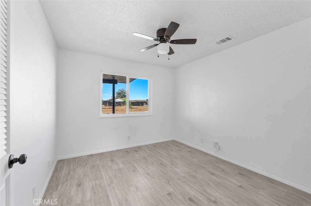 15352 Linden Street Hesperia, CA 92345 - Photo 15 of 39 wooden floor in an empty room