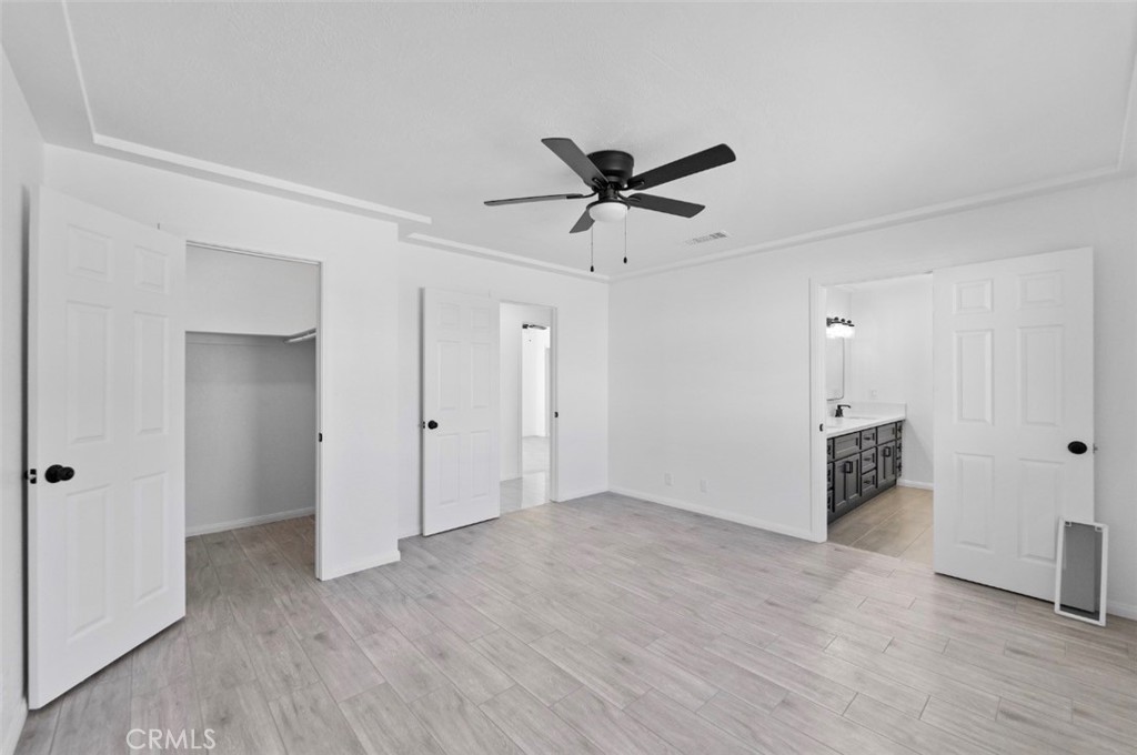 15352 Linden Street Hesperia, CA 92345 - Photo 23 of 39 a view of a livingroom with a ceiling fan window and wooden floor
