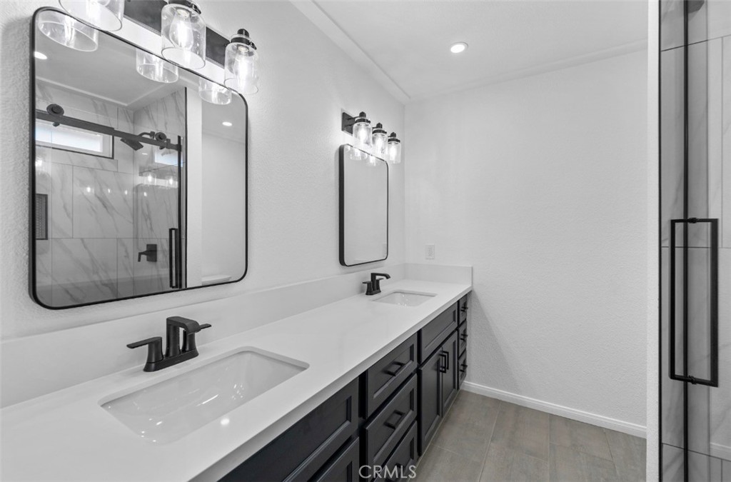 15352 Linden Street Hesperia, CA 92345 - Photo 25 of 39 a bathroom with a double vanity sink mirror and