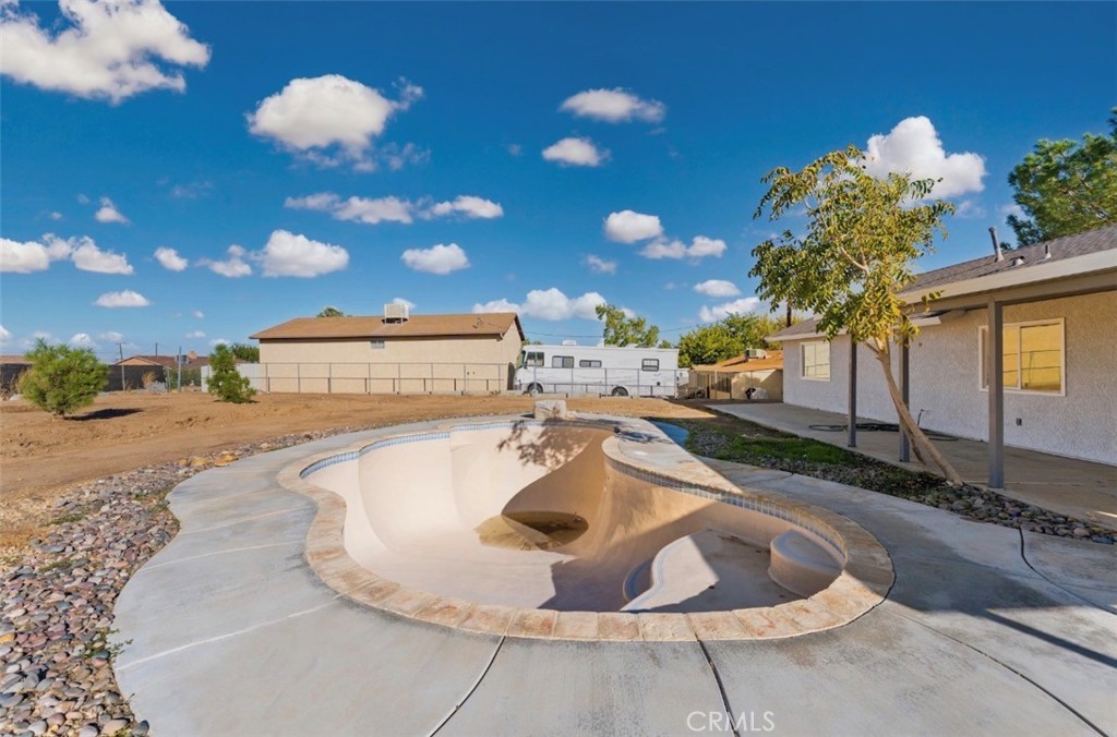 15352 Linden Street Hesperia, CA 92345 - Photo 30 of 39 a view of a swimming pool with a yard