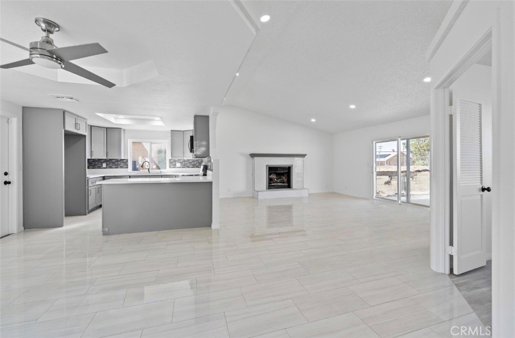15352 Linden Street Hesperia, CA 92345 - Photo 7 of 39 a view of kitchen with stainless steel appliances refrigerator oven and cabinets