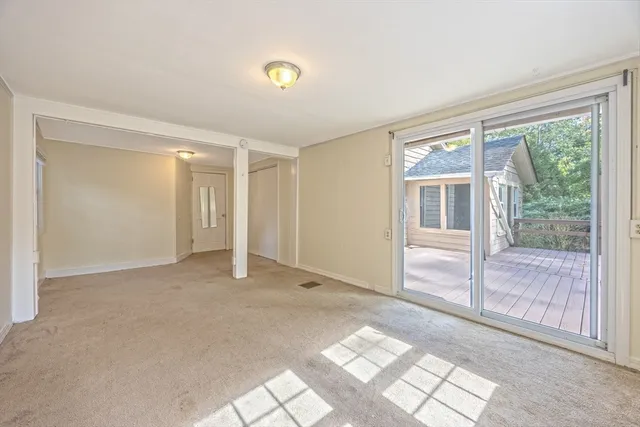 a view of a livingroom with an empty space and window