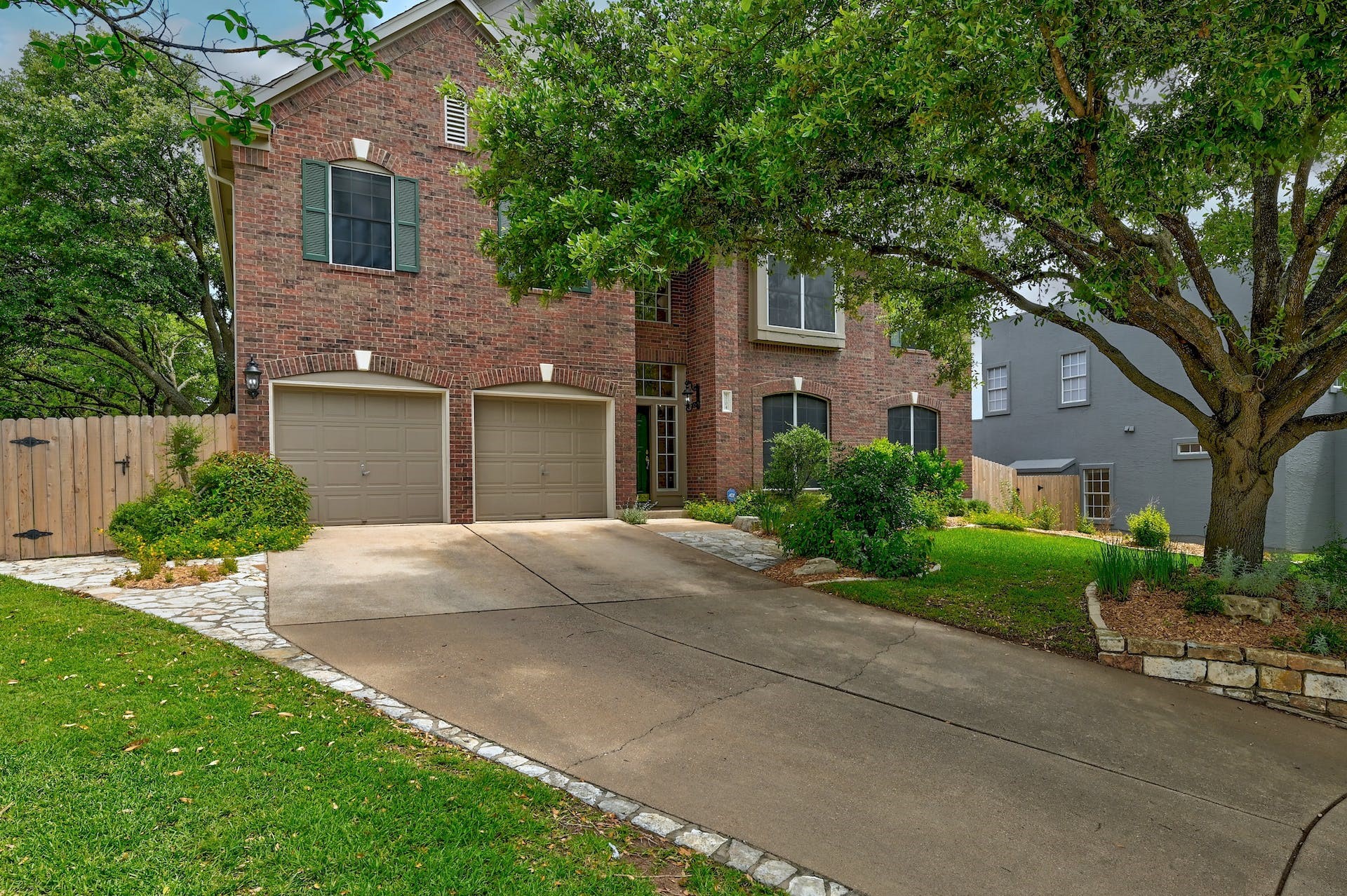 5704 Wilder Ridge Austin, TX 78759 - Photo 1 of 1 Front of house with gorgeous oak tree