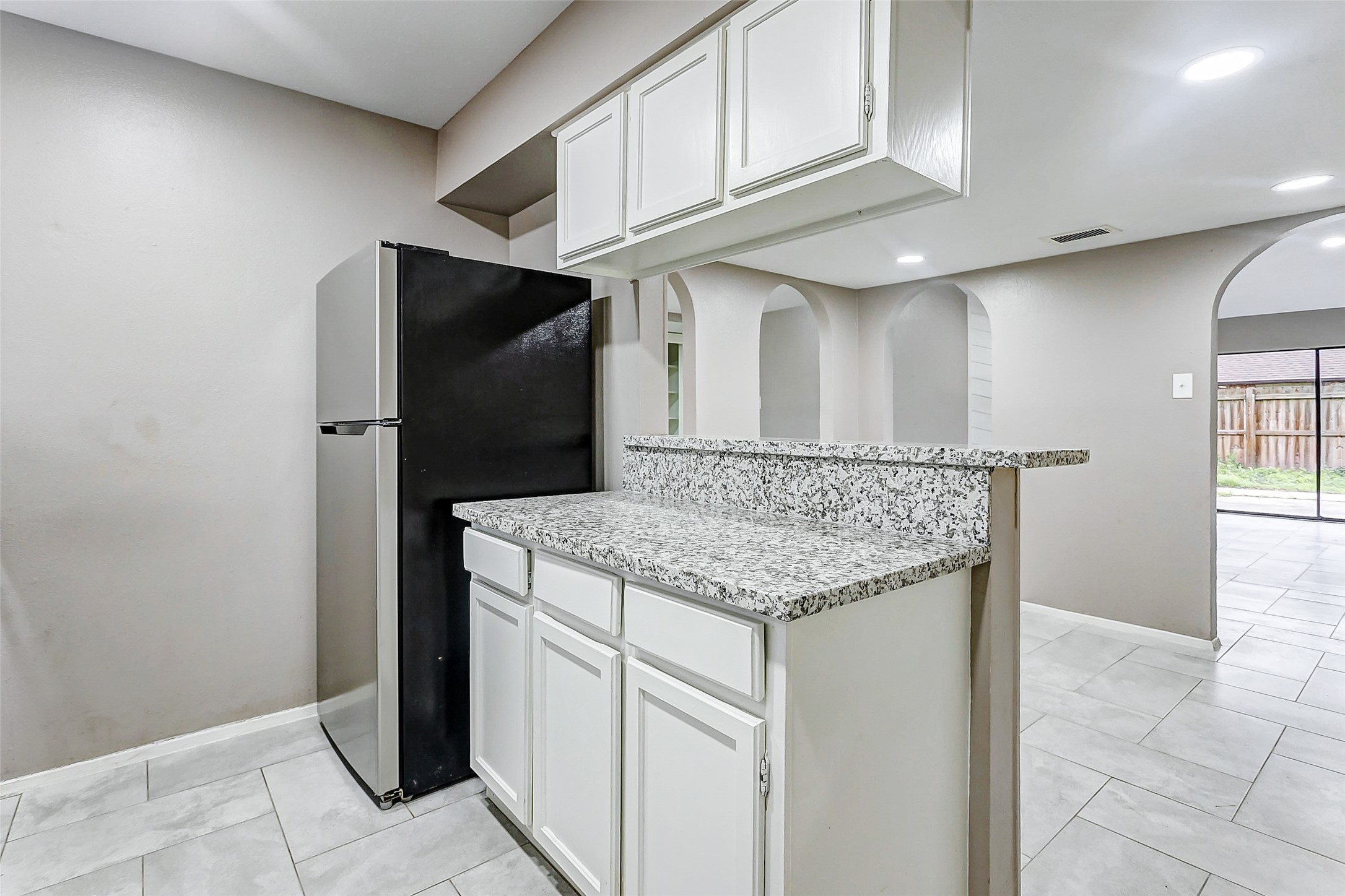 22910 Summer Green Lane Spring, TX 77373 - Photo 12 of 18 a kitchen with stainless steel appliances granite countertop a refrigerator and a stove
