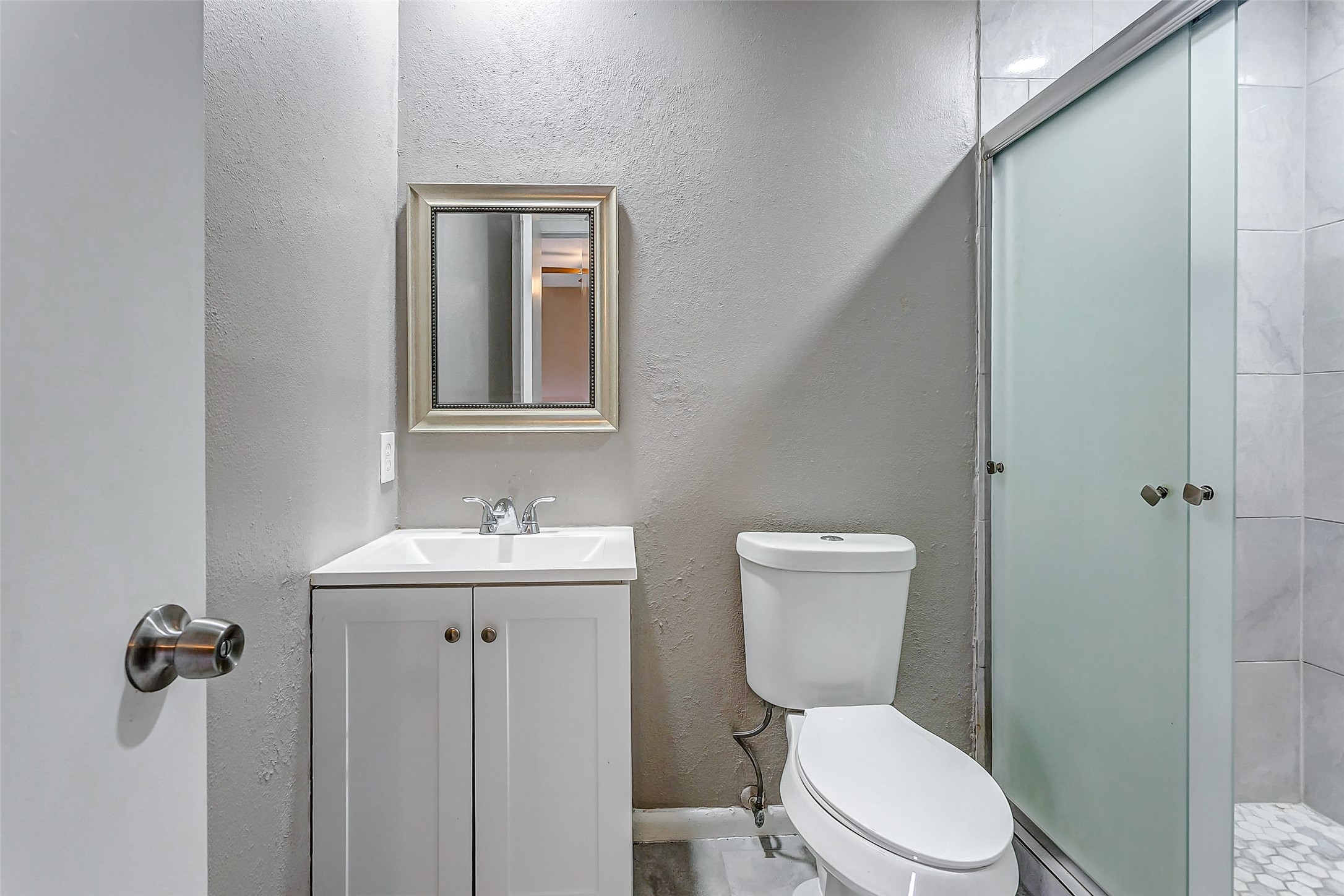 22910 Summer Green Lane Spring, TX 77373 - Photo 15 of 18 a bathroom with a toilet a sink and mirror