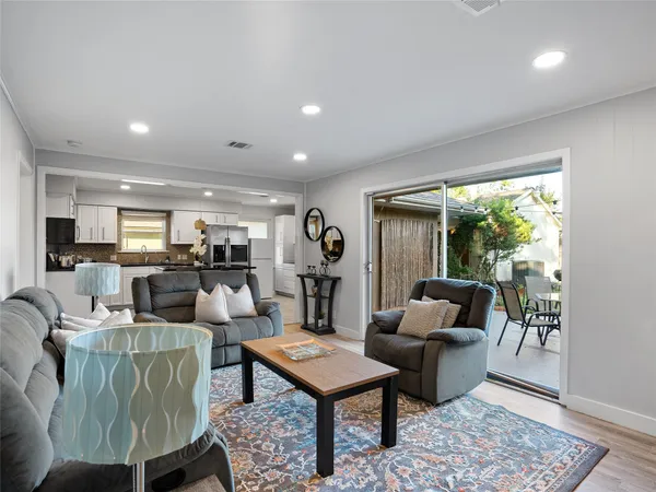 a living room with furniture and a rug