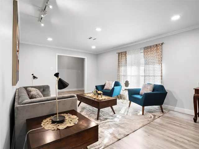 a living room with furniture and a rug