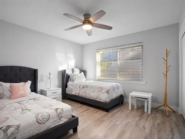 a bedroom with bed and a window