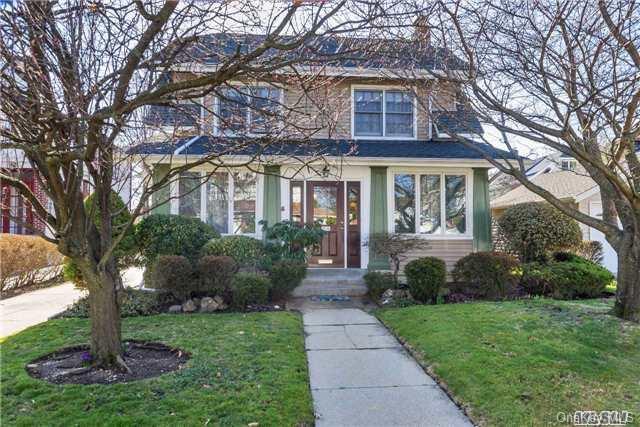 28 Thompson Place Lynbrook, NY 11563 - Photo 1 of 1 a front view of a house with garden