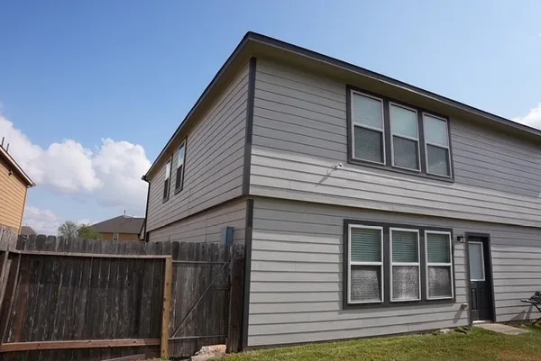 a view of a house and a yard