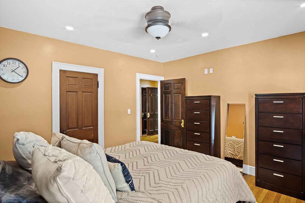 56 Summer Street Saugus, MA 01906 - Photo 11 of 29 a bedroom with a bed and cabinets