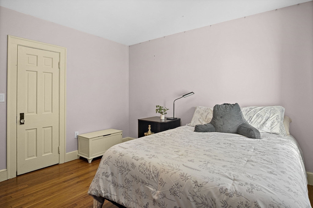 56 Summer Street Saugus, MA 01906 - Photo 12 of 29 a bedroom with a bed and wooden floor