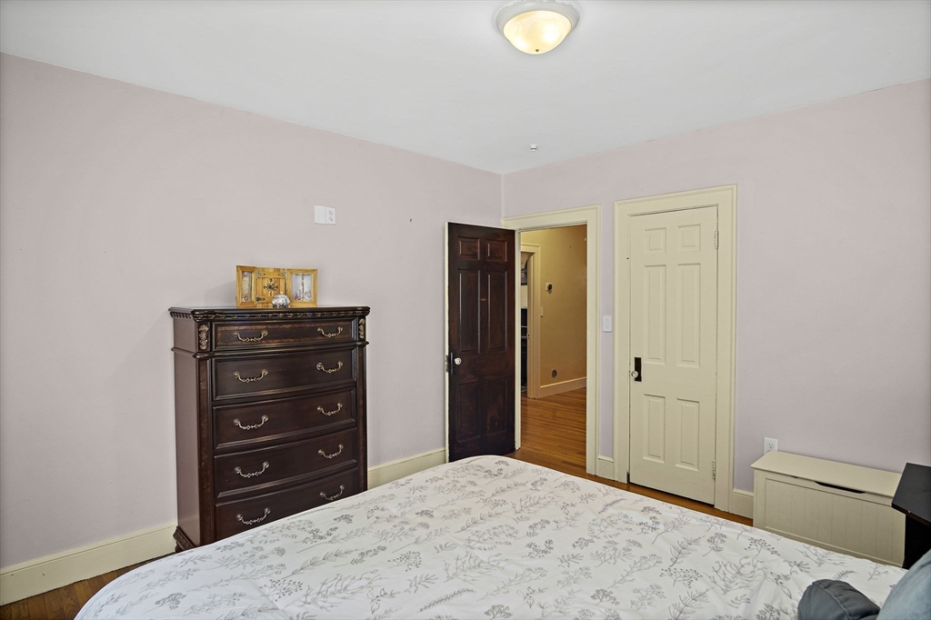 56 Summer Street Saugus, MA 01906 - Photo 13 of 29 a bedroom with a bed and a dresser