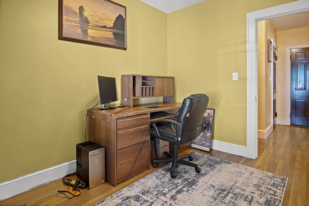 56 Summer Street Saugus, MA 01906 - Photo 15 of 29 a view of a workspace with furniture and wooden floor