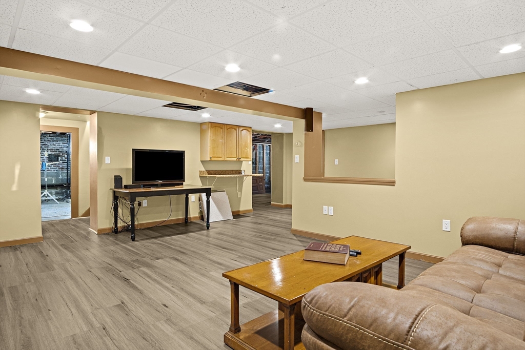 56 Summer Street Saugus, MA 01906 - Photo 19 of 29 a living room with furniture and a flat screen tv