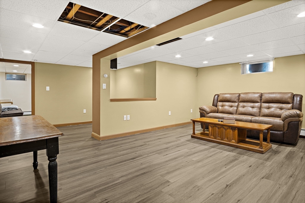 56 Summer Street Saugus, MA 01906 - Photo 20 of 29 a bedroom with furniture and wooden floor