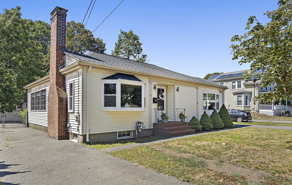 56 Summer Street Saugus, MA 01906 - Photo 28 of 29 a front view of a house with garden