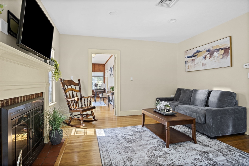 56 Summer Street Saugus, MA 01906 - Photo 4 of 29 a living room with furniture and a flat screen tv