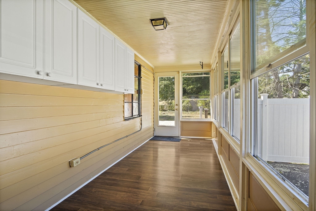 56 Summer Street Saugus, MA 01906 - Photo 9 of 29 a view of a hallway with wooden floor and staircase