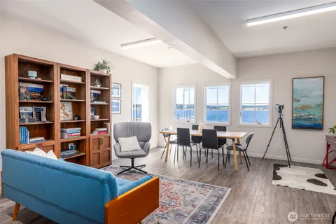 a view of a dining room with furniture and window