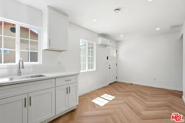 a view of a kitchen with cabinets
