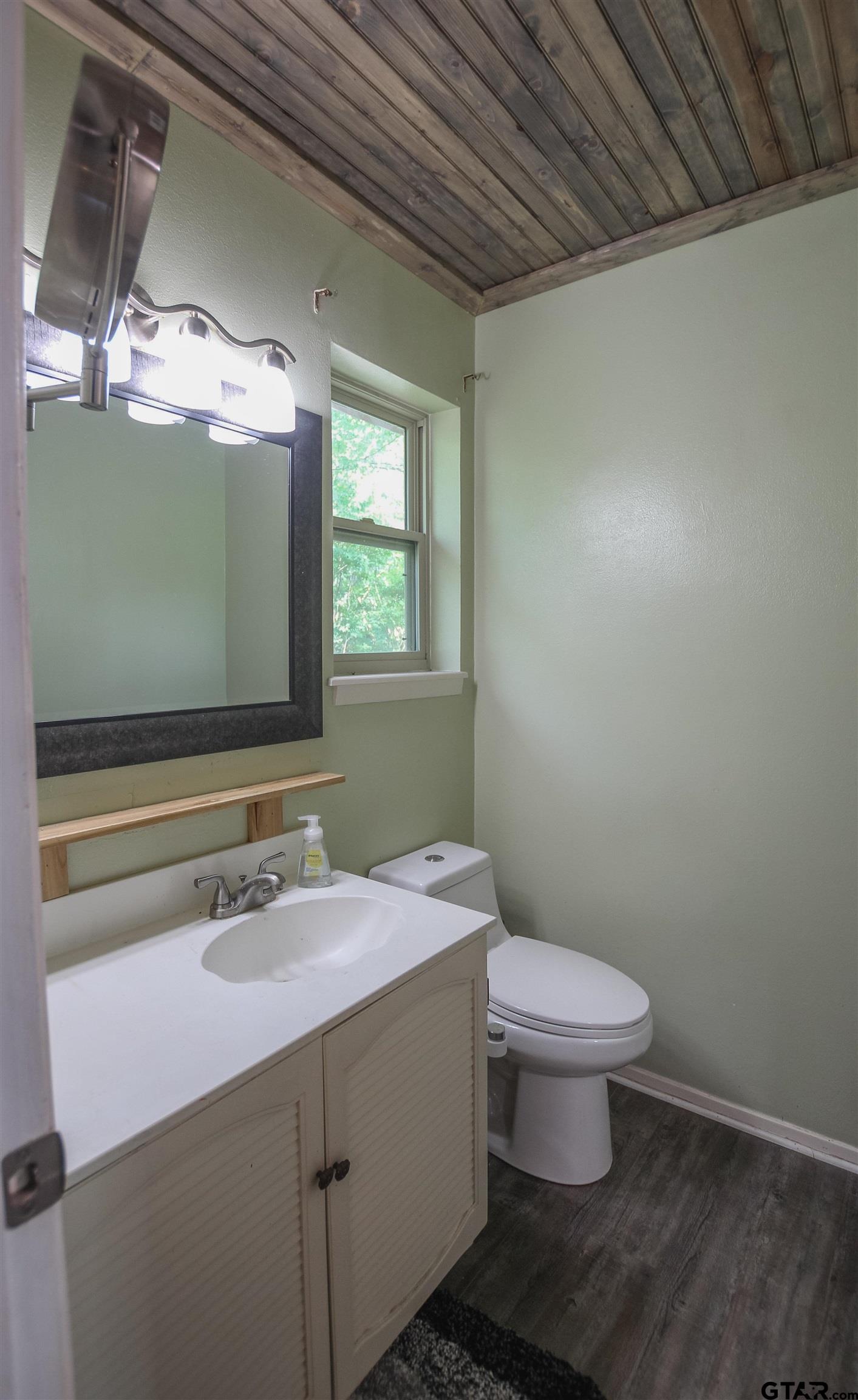 7546 Hill N Dale Road Tyler, TX 75709 - Photo 12 of 24 a bathroom with a sink toilet and mirror