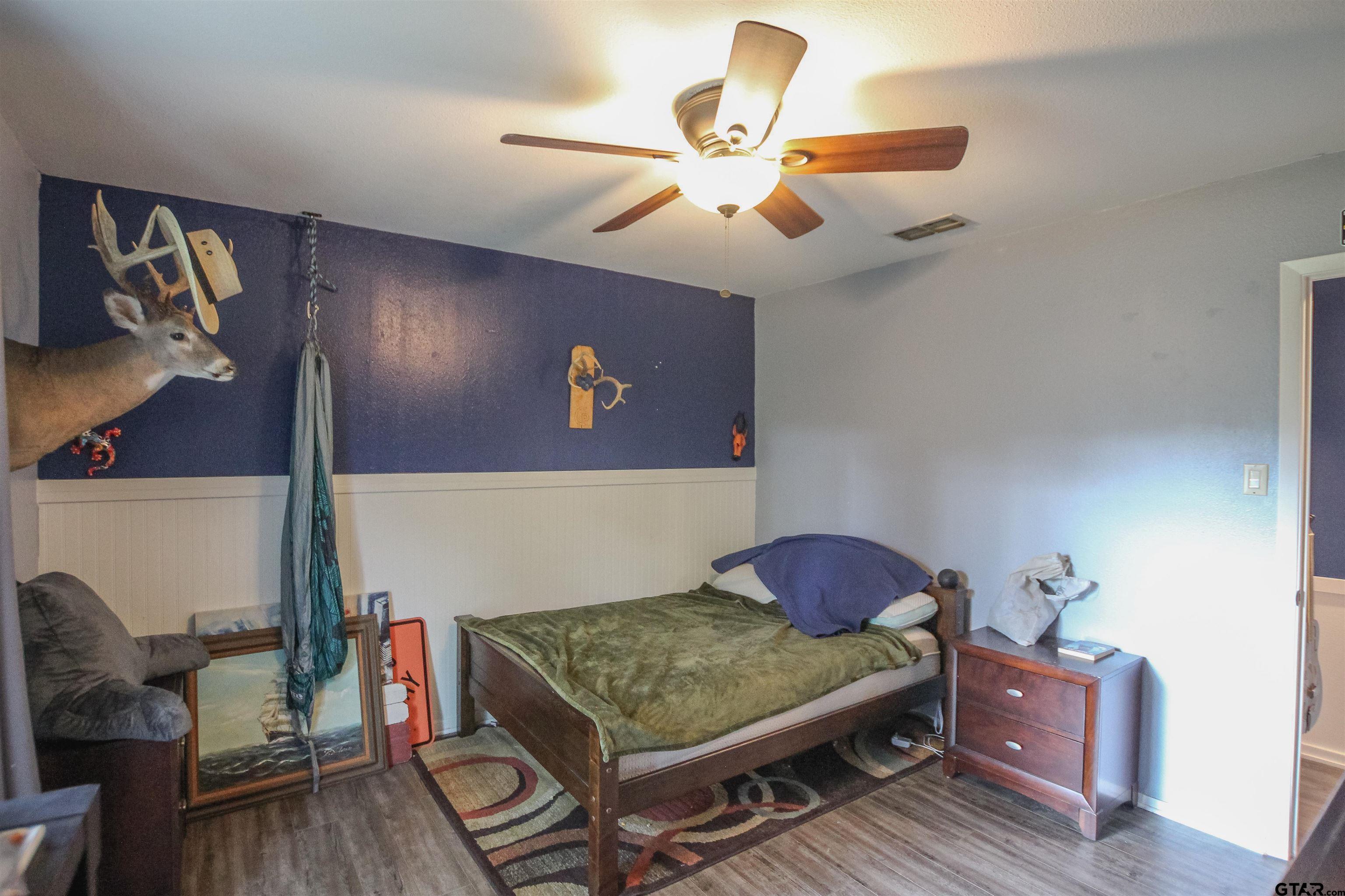 7546 Hill N Dale Road Tyler, TX 75709 - Photo 17 of 24 a living room with couch and dining area