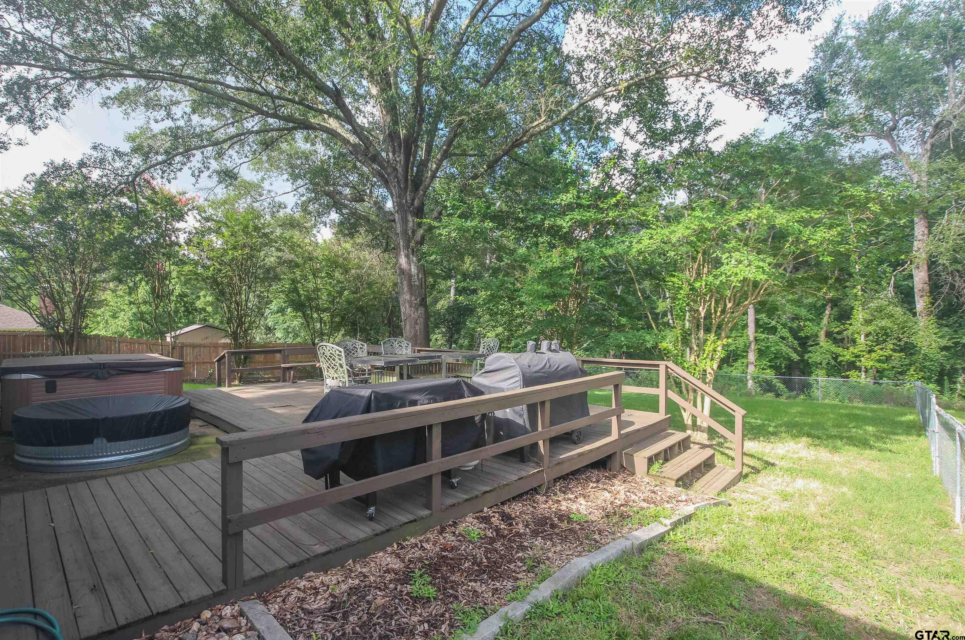7546 Hill N Dale Road Tyler, TX 75709 - Photo 20 of 24 a view of a house with backyard and sitting area