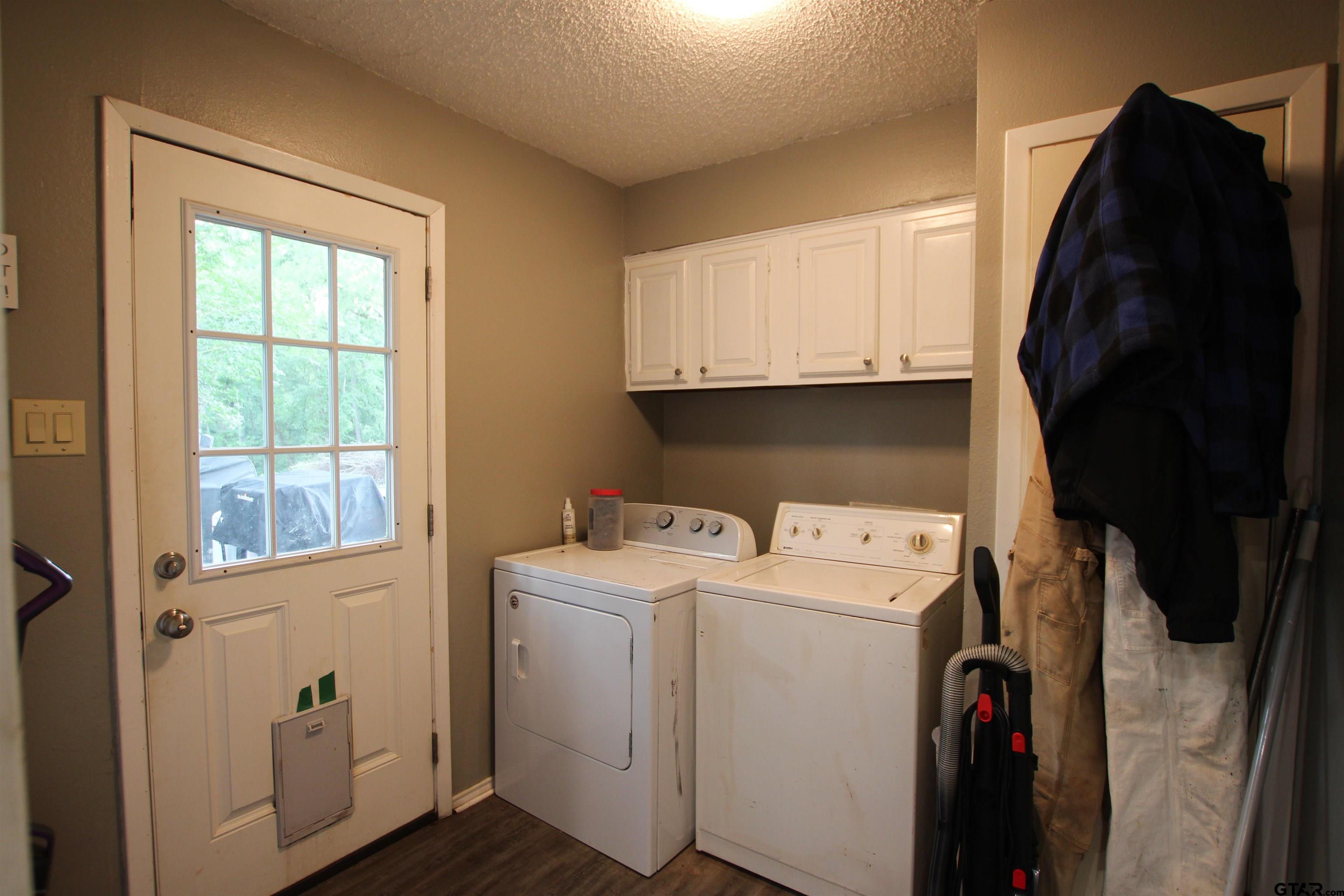 7546 Hill N Dale Road Tyler, TX 75709 - Photo 9 of 24 a utility room with dryer and washer
