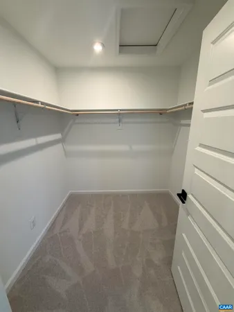 a view of an empty walk in closet