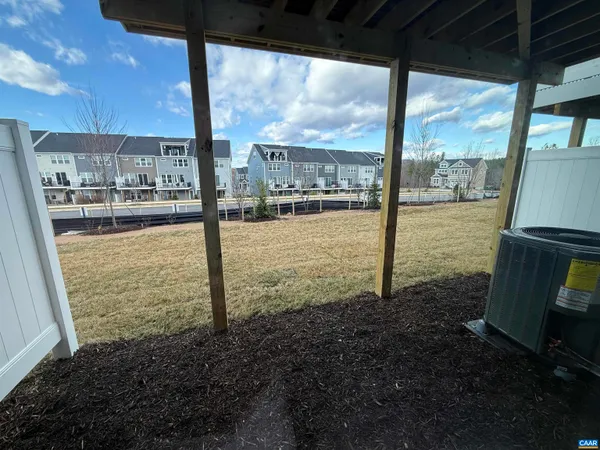 a view of a glass door with a floor to ceiling window