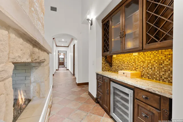 a kitchen with stainless steel appliances granite countertop a stove sink and cabinets