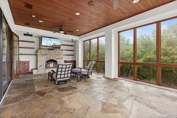a view of a livingroom with workspace and a window