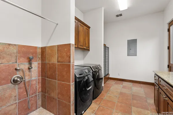 a bathroom with a granite countertop sink a toilet and bathtub