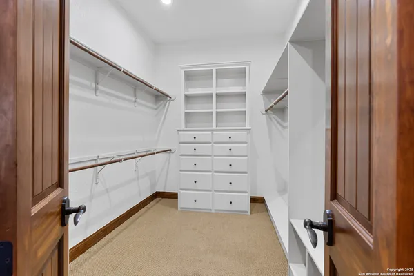 a open kitchen with stainless steel appliances granite countertop a stove a sink and a microwave