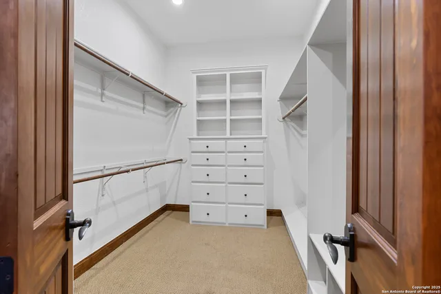 a open kitchen with stainless steel appliances granite countertop a stove a sink and a microwave