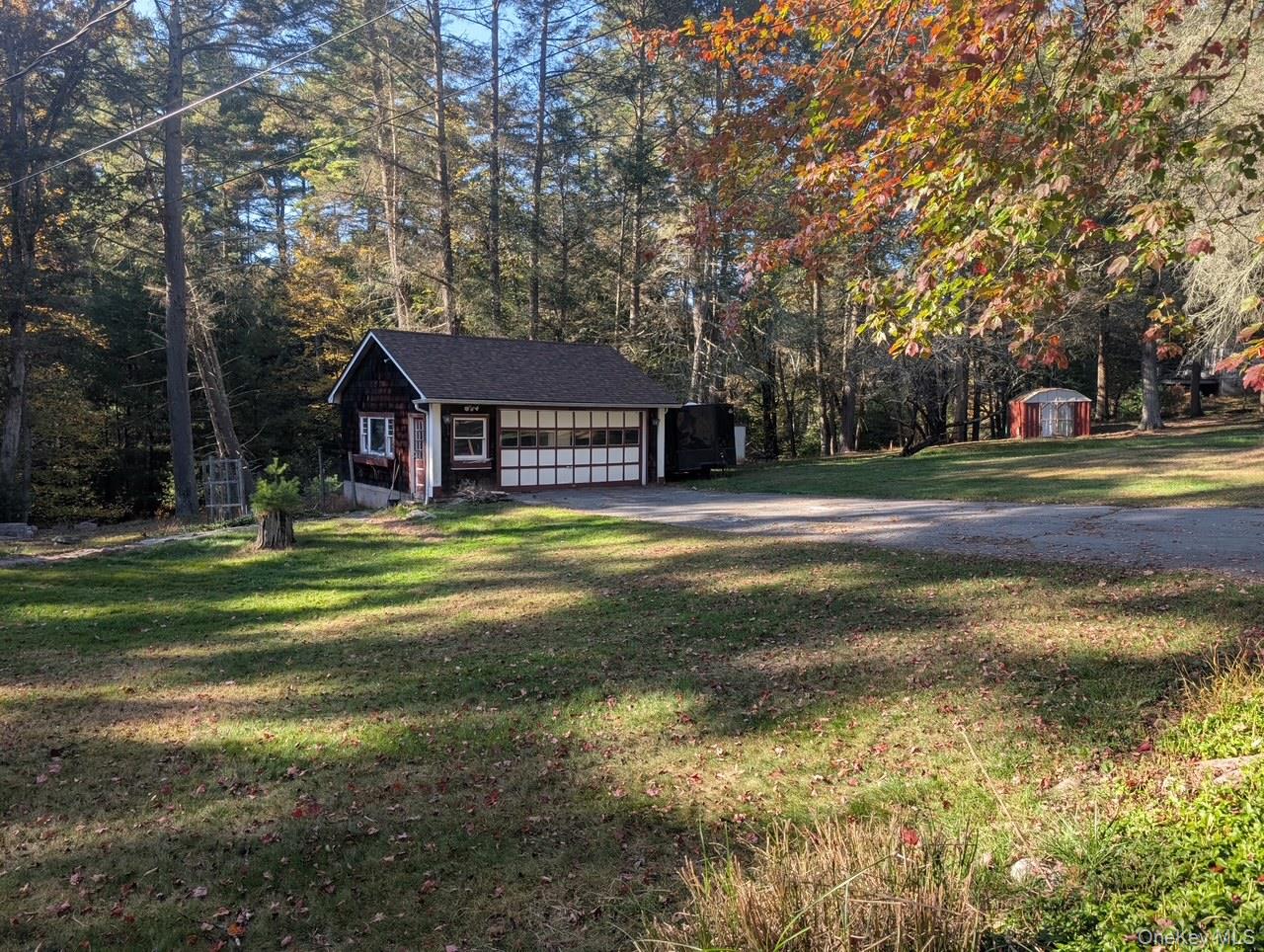 50 Park Road Yulan, NY 12792 - Photo 13 of 14 a front view of a house with a yard table and chairs