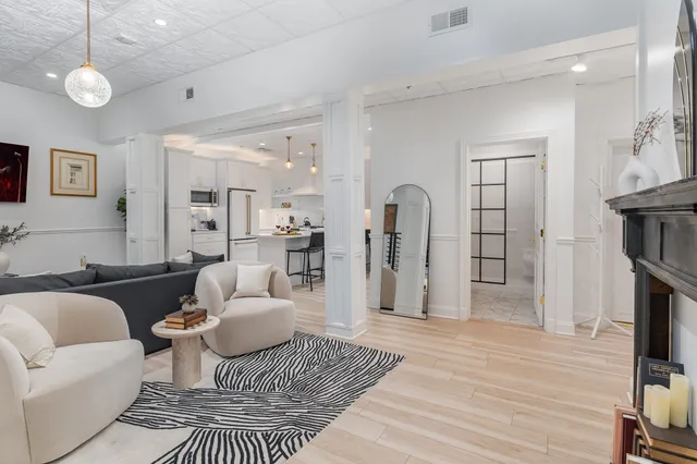 a living room with furniture and a table
