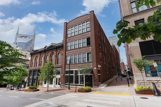 a view of a building with a street