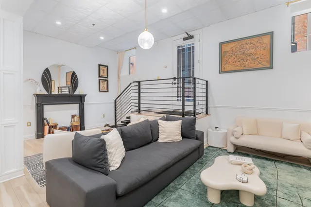 a living room with furniture and a rug