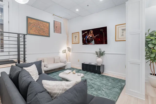 a living room with furniture and a couch