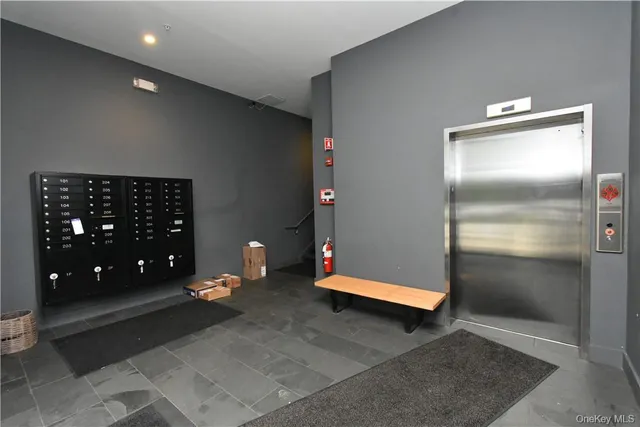 a kitchen with a sink a refrigerator and cabinets