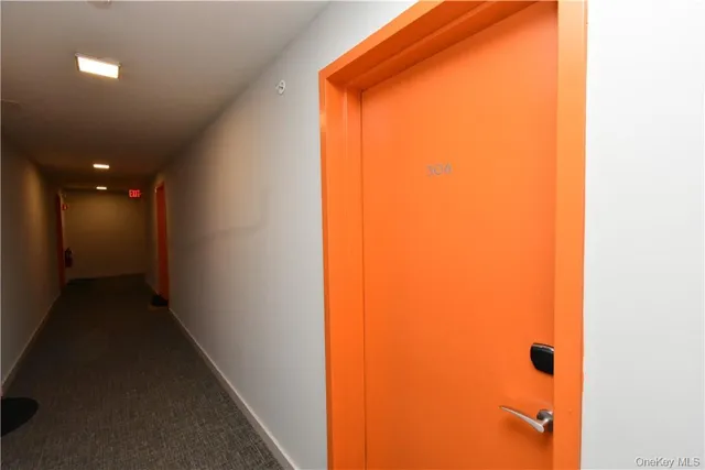 a kitchen with a refrigerator a sink and cabinets