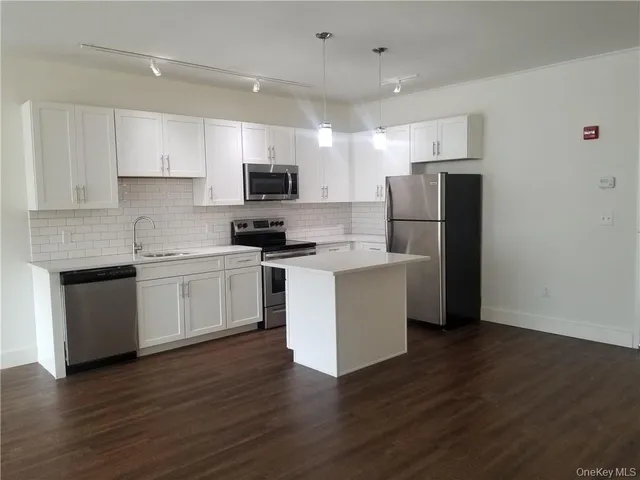 a view of a living room with a large window